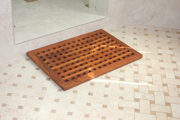 If you're looking for a new take on a classic, opt for this sturdy teak shower mat with a grate design. Its compact size is ideal for smaller bathrooms. Plus, there's a five year warranty. No complaints here.
