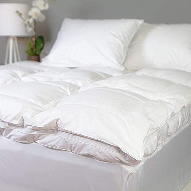 This plush topper features two layers of down fill that will feel like sleeping on a cloud each night. 