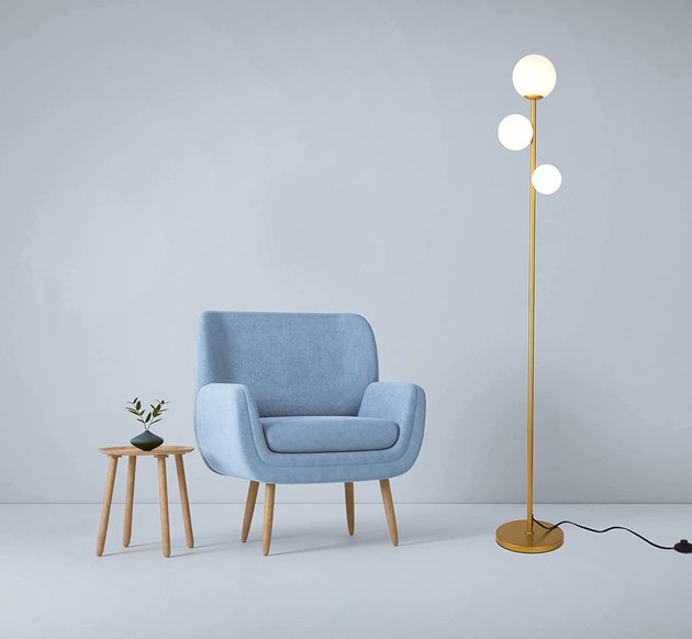 The frosted glass globes of this midcentury-inspired floor lamp create a lovely diffused light in any room.