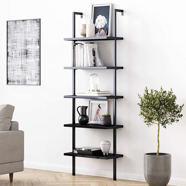 Update your bookcase with this modern bookcase with a durable metal frame. It has five open shelves and is wall mounted with an easy, 25-minute assembly.