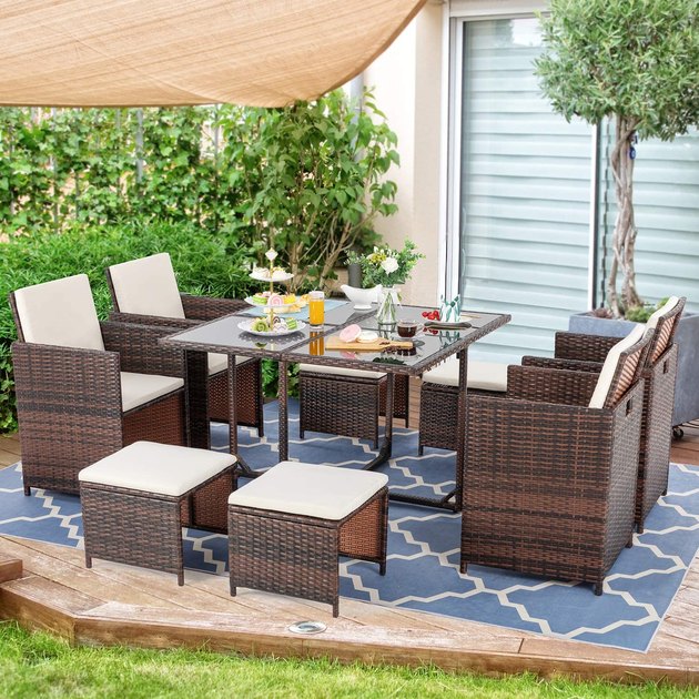 It's difficult to think of anything wrong with this dining set. The tempered glass table and UV-protected, waterproof wicker are easy to wipe down, and the cushion covers are washable. Be sure to check out a photo of the ottomans and chairs fitting perfectly under the table when the set's not in use. It's pretty mind-blowing.