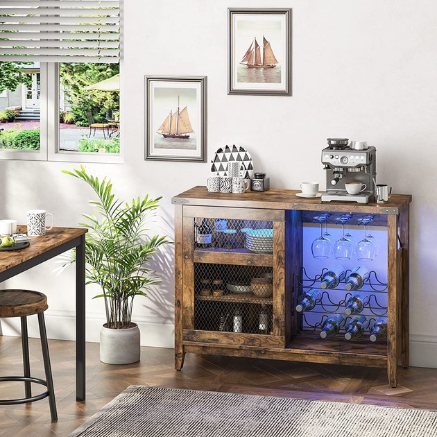 Spruce up your wine experience with this wine cabinet that comes with LED lights and 3 tiers of storage space. Great way to show off your collection.