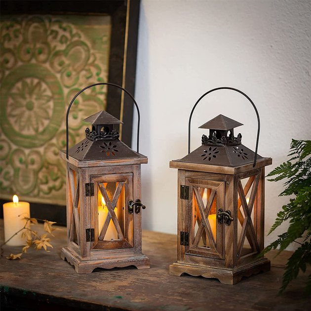 A stylish rustic lantern made from distressed pine wood and metal detailing. This lantern would be the perfect finishing touch for a table centerpiece or just to add warmth to your next outdoor gathering. 