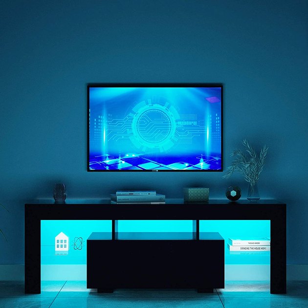 This LED TV stand is the perfect addition to any gamer's setup. This LED TV stand comes with a drawer that stores your consoles, disc, and controllers