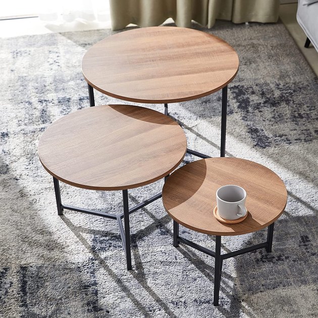 Whether you have a small apartment or a cramped home office, these round nesting coffee tables are extremely functional. They’re sold in a set of three and can be arranged in a variety of ways.