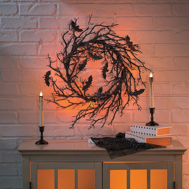 With bats, lights, and a sparkly finish, we’re loving this chic Halloween wreath.