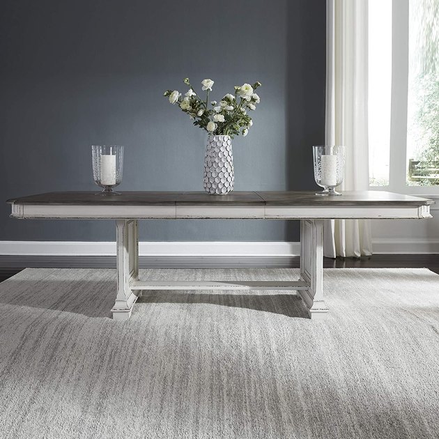 This extendable dining table masters the look of farmhouse decor with elements of wood, white, and an aged texture. Though it’s already sizeable at 98 inches, it also features a 20-inch leaf for additional seating.