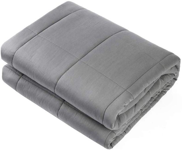 The Waowoo Weighted Blanket is a great option for anyone looking for an extra affordable and highly-praised blanket. This queen size blanket weighs 15 pounds and premium glass beads stored in smaller pockets to ensure they're evenly distributed. 