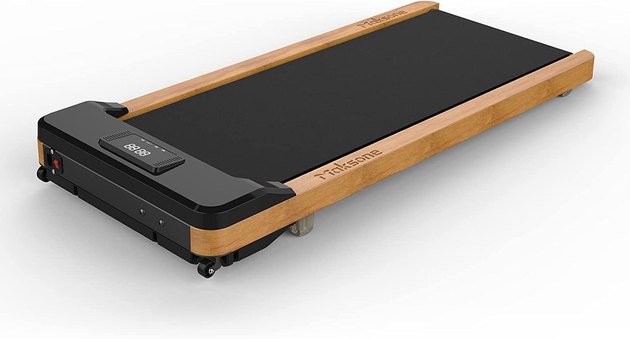 Wood panels give this under-desk treadmill a chic minimalist look.