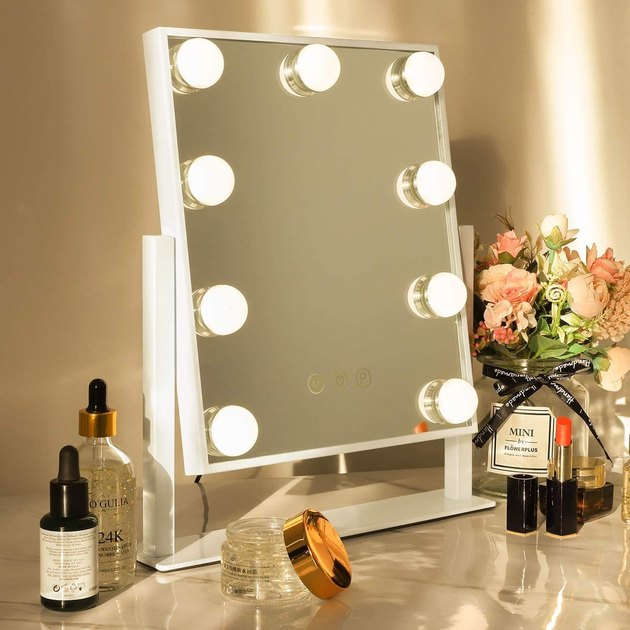 Keep it classic with this vanity mirror that features Hollywood-style bulbs. Not only do they look cool, but they'll also allow you to execute a perfect makeup look at any time of day. Plus, the LED bulbs have a whopping 50,000 hour life span.