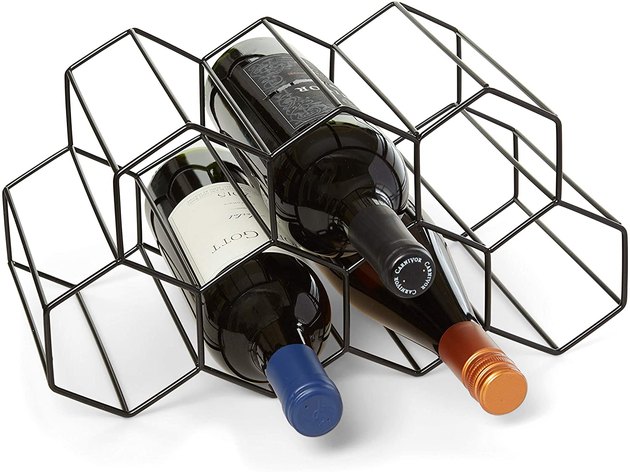 Store your wine in style with this no-assembly wine rack. It can hold up to nine wine bottles and is scratch-resistant.