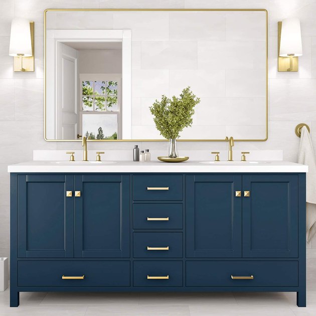 Crafted from solid hardwood and plywood, this double bathroom vanity is built to last. It comes in three base colors and has two ceramic oval under-mount sinks included. It also has a generous three-year warranty.