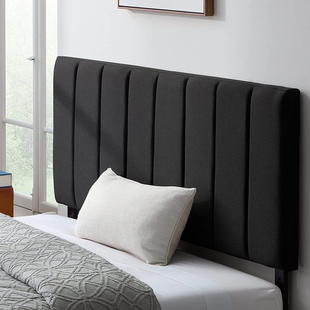 Our top pick is this versatile upholstered headboard that comes in a variety of styles, from diamond tufted to nailhead trim. It’s also height adjustable from 36 to 48 inches and can fit most bed frames and bases.