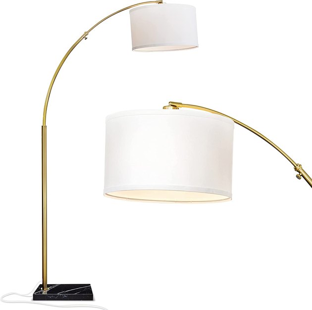 Illuminate a hard-to-reach spot in your room with this elegant arc floor lamp, which has a classic drum shade and a sleek marble base.