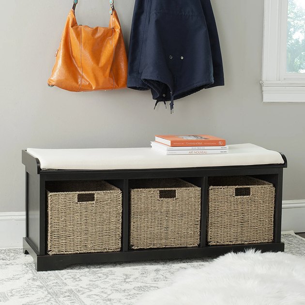 This is a distinctive wood storage bench with three cubbies for basket storage — the baskets are included with the bench.