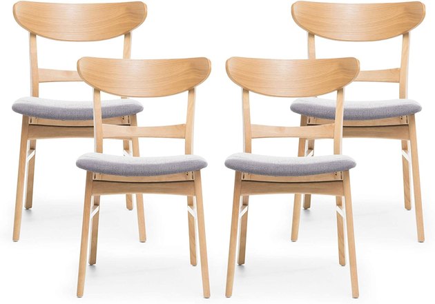 Complete your dining room with these stunning dining chairs, crafted with curved backs, upholstered seating, and solid wood frames.