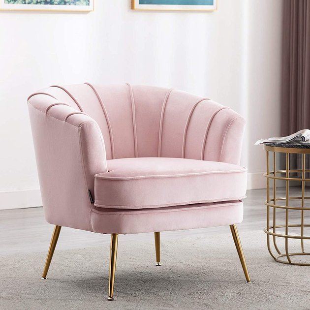 With its velvet upholstery and gilded legs, this barrel chair will instantly make any space feel more glamorous. 