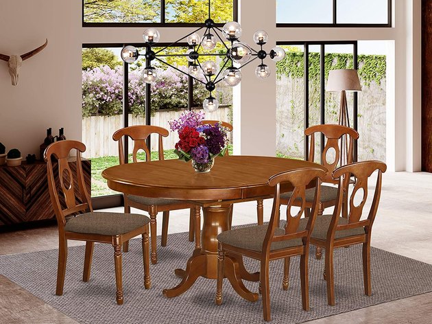 This beautiful dining set will instantly elevate a formal dining room design with timeless sophistication. 
