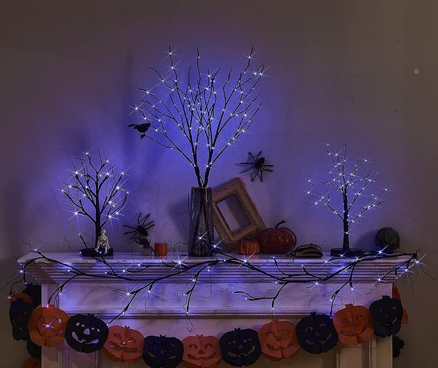 Take your Halloween decor up a notch with this glitter garland packed with 48 LED orange and purple lights.