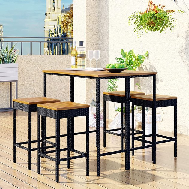 Beautifully textured rattan and rich wood come together to create this simple yet special dining set. Whether you're sipping on cocktails or sitting down for a midday meal, this bar height bistro set will make the perfect addition to your backyard, deck, or patio.