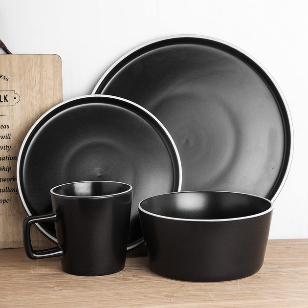 This minimalist, modern set manages to be both simple and funky at the same time. Select between service for four or eight people, with each place setting including two plates, a bowl, and a mug.