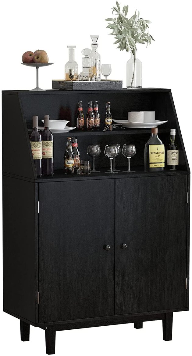This compact winebar is the perfect addition to your apartment. This compact wine bar holds up to 16 bottles.