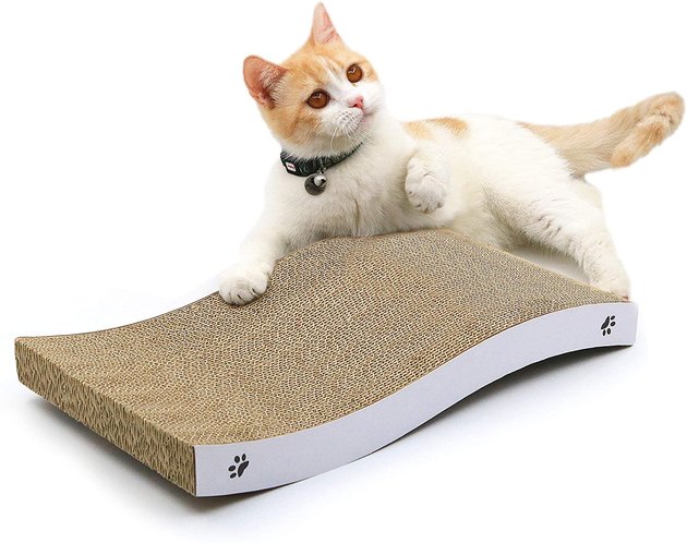 Not only is this reversible cat scratcher made of recycled cardboard, but it can also be used as a cat bed and lounge chair, thanks to its curved design.