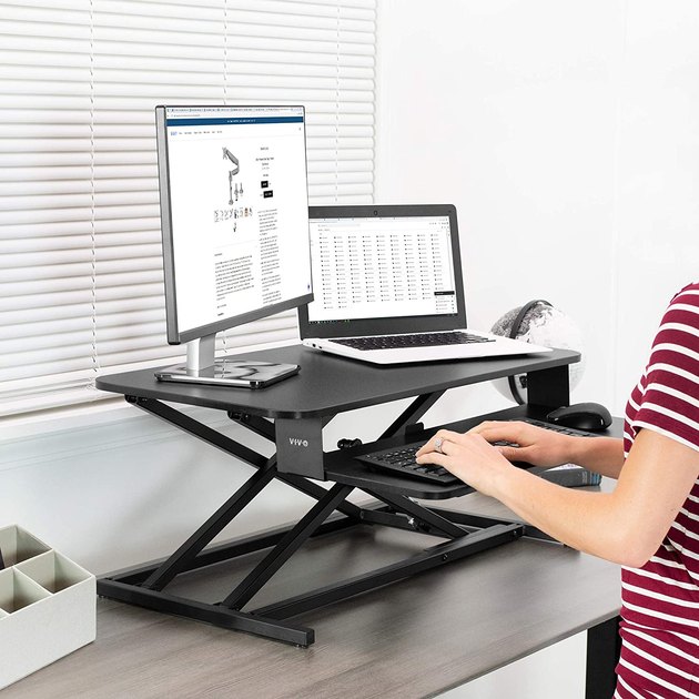 Turn any desk into a standing desk with this tabletop converter. This one features a smooth lift assist and two functional levels. It also comes in colors to seamlessly match your current desktop surface.