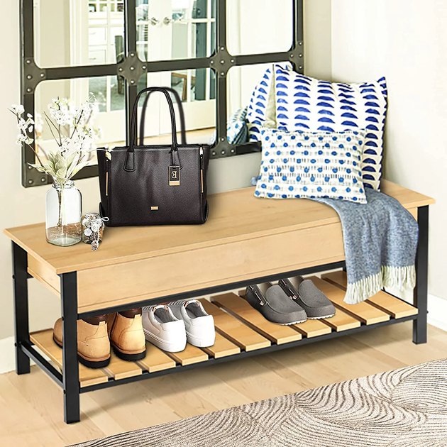 At a very affordable price point, this storage bench combines the best of both storage worlds: it has both a closed section with a hinged lid and an open shoe rack.