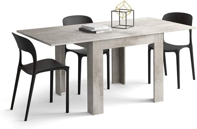 This extendable table features a concrete-like finish and is perfect for more modern spaces. It opens and closes like a book to seat four or eight.