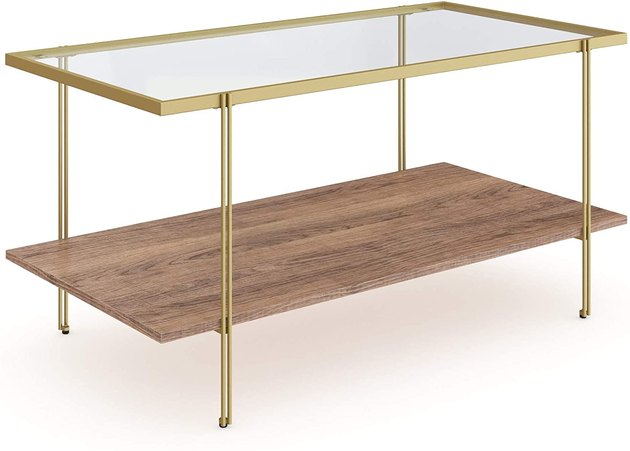 The combination of rustic oak, glass, and a brass frame is a true match made in heaven. The clear top layer makes it easy to display your favorite coffee table books and knickknacks on the bottom wooden shelf. Another perk? This table has a lifetime manufacturer warranty.