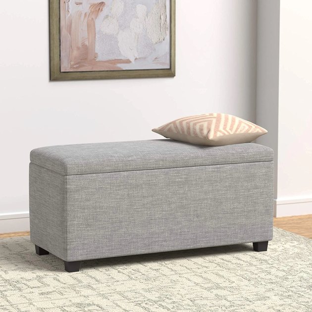 From toy chest to end of bed bench, this Amazon Basics storage ottoman can do it all and more. It’s reasonably priced and offered in three neutral hues to fit any home decor style.
