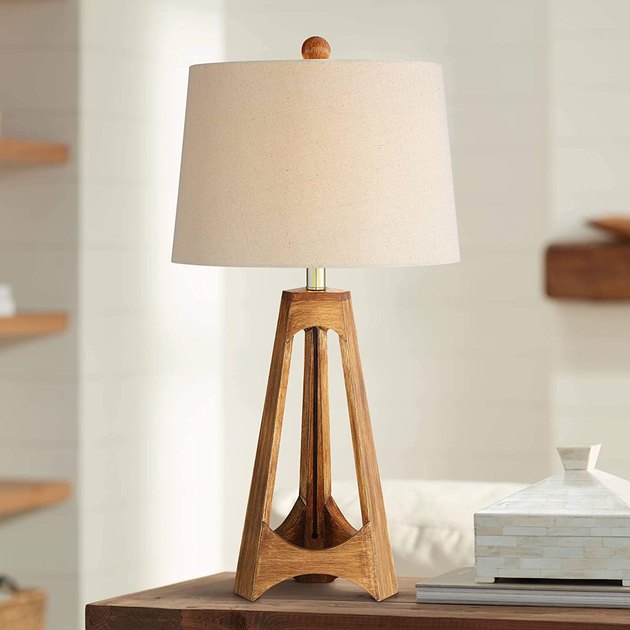 The combination of oak wood and an oatmeal drum shade will add a distinct warmness to your space. The The tripod base and round finial at the top are just a couple added details that make this simple piece into something really special.