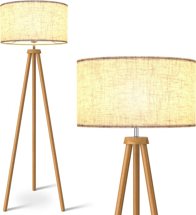 This tripod floor lamp with a textured linen drum shade comes in two colors: walnut and brown.