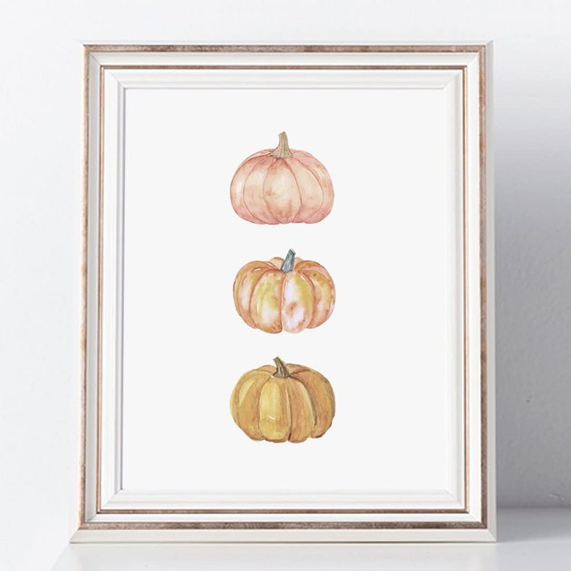 This simple pumpkin water is the perfect way to subtly shout out the fall season on your walls. Be forewarned that the print does not come framed.