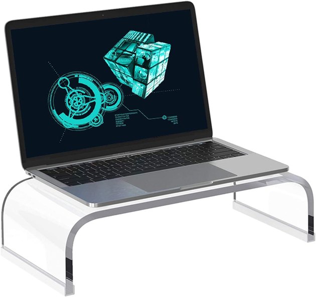 This acrylic laptop stand will instantly elevate your desk space. It features a transparent waterfall style and is constructed with a functional anti-slip base.