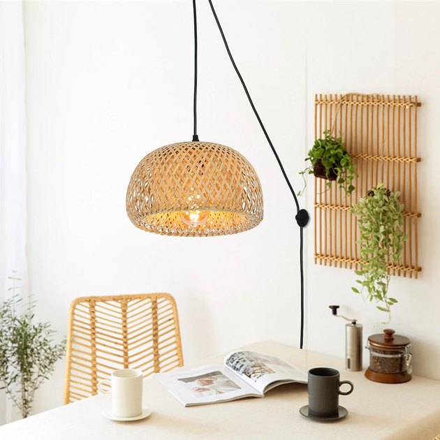The Galeville bamboo plug-in pendant is adjustable, has a switch, and is perfect for adding ambiance to any room — without electrical wiring. 