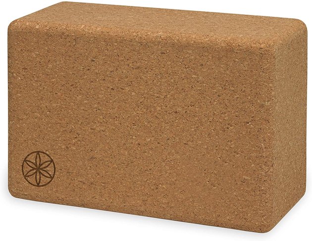Yoga blocks can be great tools during a yoga class, but they can help you lean in to stretches outside of asana, too. This yoga block not only offers just that, but it's also made of cork to provide added durability and grip.