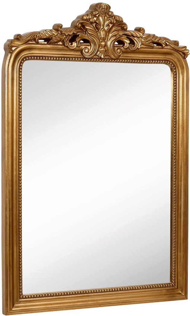 This wall mirror from Hamilton Hills has stunning gold detailing and a crown top design to give your home a vintage flair.