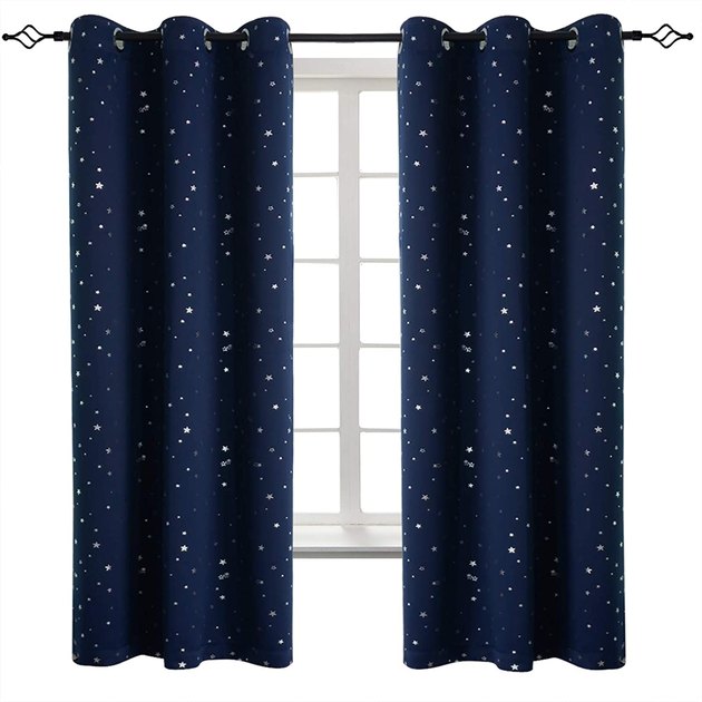 Silver stars dot these fun blackout curtains for a kid's room. They come in pastels, grays, white, and navy blue.