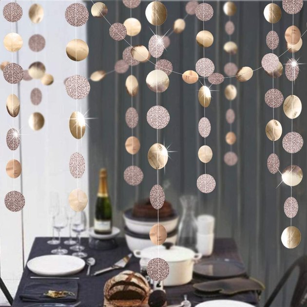 Add a little sparkle to your setup with these four strings of garland. Each piece is made with heavy-duty cardstock and hand sewn with sturdy silver string, and can be cut to different lengths, if desired.