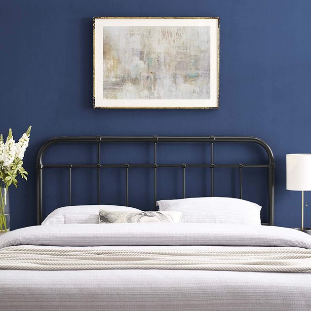 Switch up your style with this modern metal headboard that has smooth curves and spindle detailing. Made with powder-coated iron, it’s durable, sleek, and built to last at a more affordable price point. It’s also height adjustable and can fit most queen bed frames.