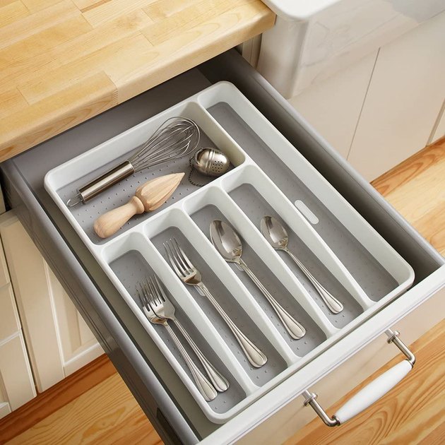 Sick of things rustling around in your drawers? Here's your answer. This six-compartment silverware tray features both soft-grip lining and non-slip rubber feet to ensure all your cutlery, tools, and gadgets stay in place. Plus, it rings up at a very happy price point.