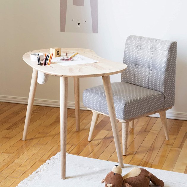 This desk looks so good that we seriously want it in our size. Between the light washed natural wood, angled legs, and plush fabric chair, this set will ensure your kid's bedroom looks effortlessly cool.