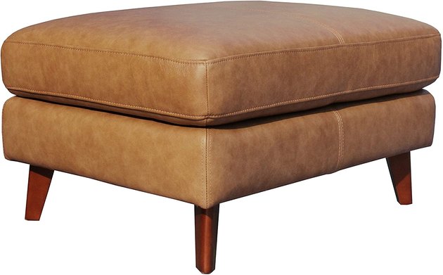 Get a classic midcentury modern look with this Rivet ottoman, complete with a leather cushion and tapered wood legs.