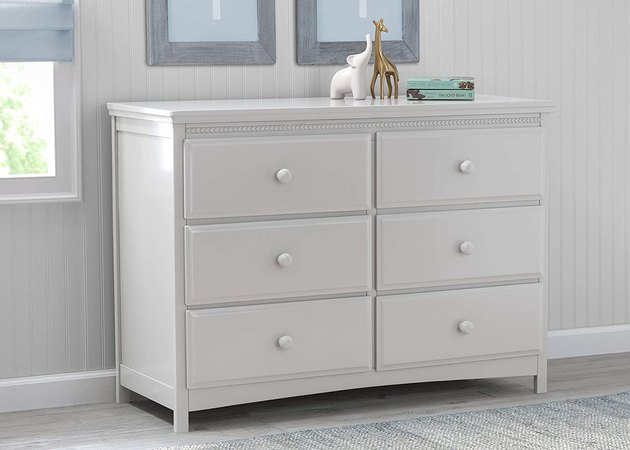 Everything about this dresser is great. From the simple design with artistic detailing to the ample storage, it's the perfect pick for nearly any kid's room. It's sold in both white and gray finishes.