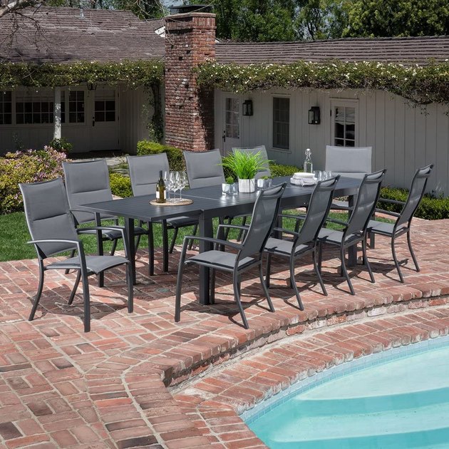 Host in style with this set that fits 10. Made with a heavy-duty, rust-resistant, and weather-resistant aluminum frame, this table is big on durability. Also, the outdoor fabric on the seats dries quickly and resists fading, all while maintaining its soft feel.