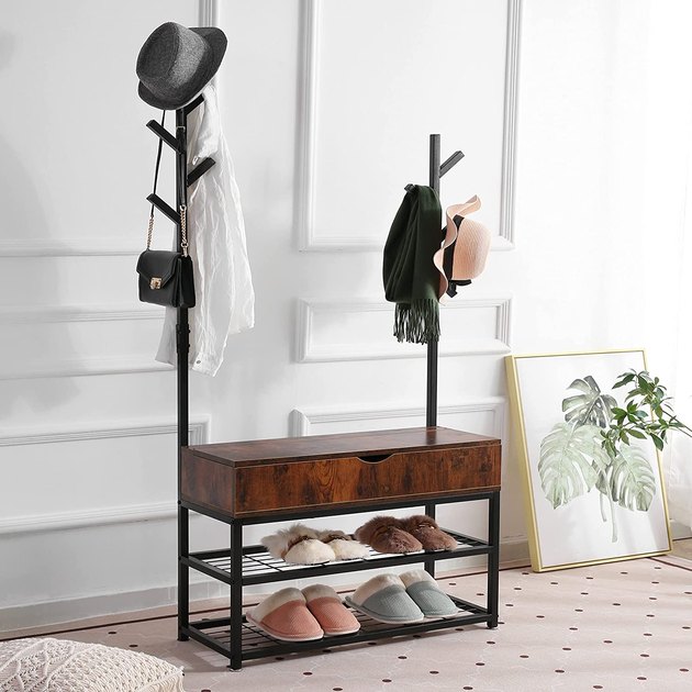 This clever space-saving solution has all your entryway needs in one. It's a coat rack, shoe rack, bench, and a lift-top storage box. It's also just a good-looking piece of furniture. 