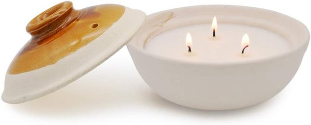 Leave it to Amazon to sell such a high-design candle at this incredibly affordable price. Select between two neutral colors of handmade pottery to hold this three-wick soy wax candle. It will make the perfect addition to either your outdoor or indoor living area.