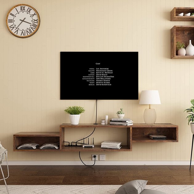 This floating TV stand adds flair to any small space. This TV stand comes with three shelves that leave plenty of space.